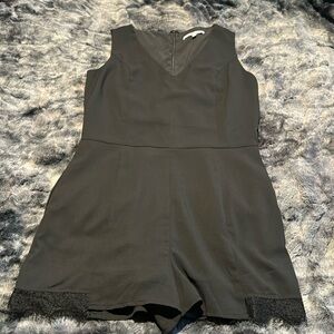 Naked Zebra, size small, black, sleeveless, short romper. Lace detailing.